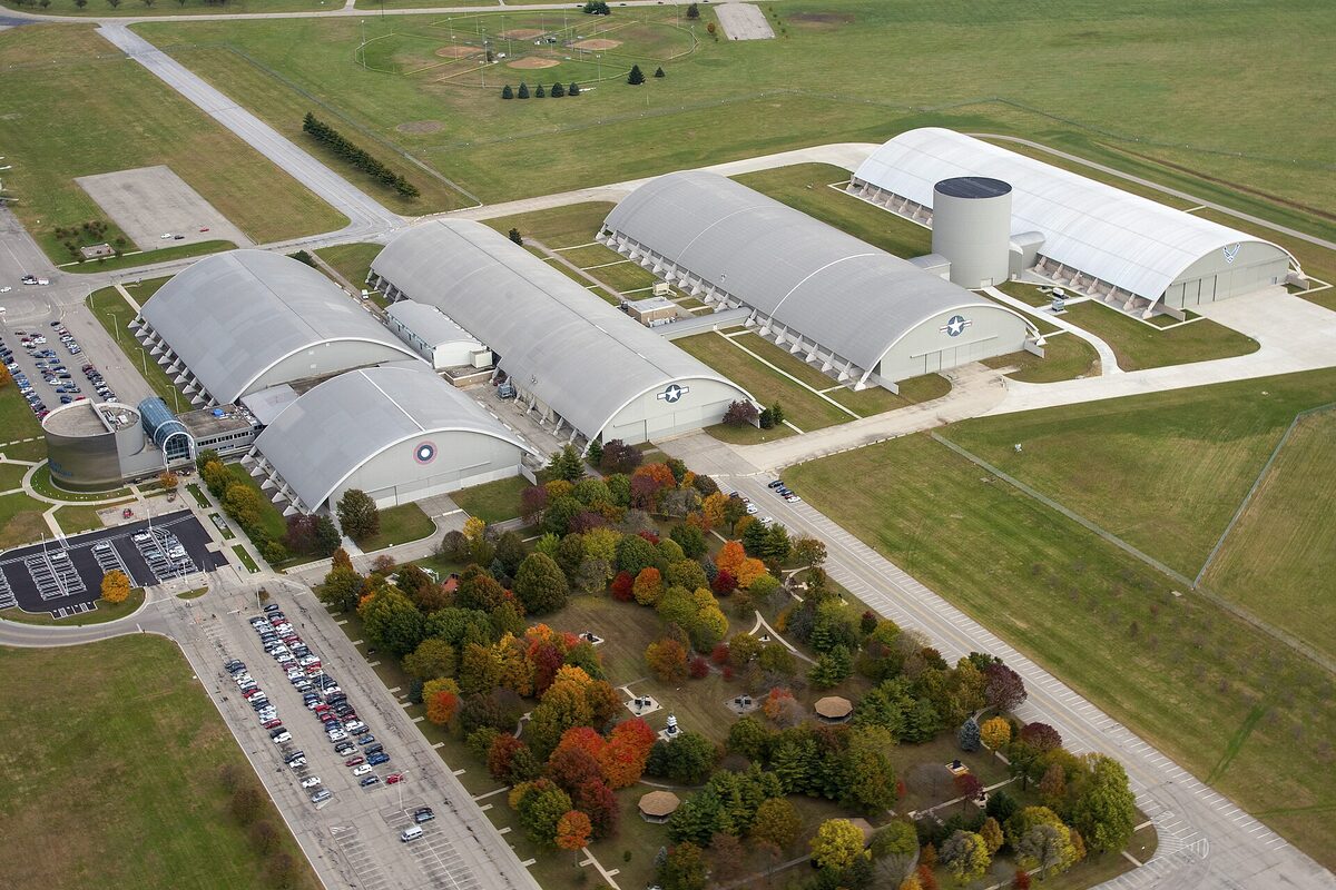 Aerial view of the National Museum of the U.S. Air Force hangars with autumn trees